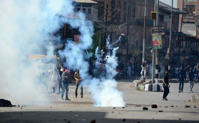 Protesters pelt stones at policemen in Srinagar, April 17. Photograph: Umar Ganie