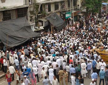 Onlookers near Yakub Memon's building after his body was brought to Mahim, Mumbai