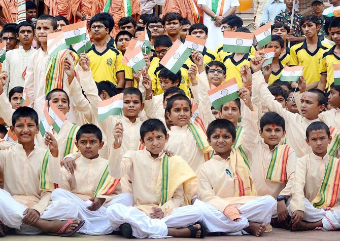 Students of Swaminarayan Gurukul holds tricolour to mark the celebrations of 69th Independence Day in Ahmedabad. Photograph: PTI