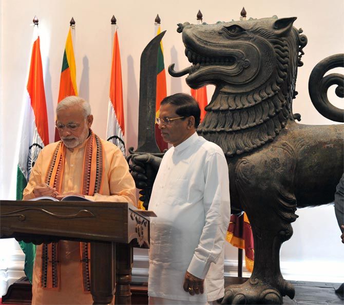 IMAGE: Prime Minister Narendra Modi and Sri Lankan President Maithripala Sirisena during the Indian leader's visit to Colombo, March 13, 2015. Photograph: Press Information Bureau
