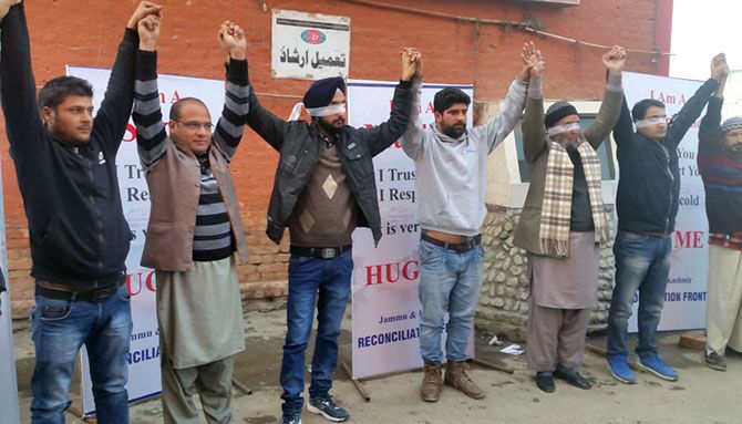 Participants in the hug me campaign in Srinagar