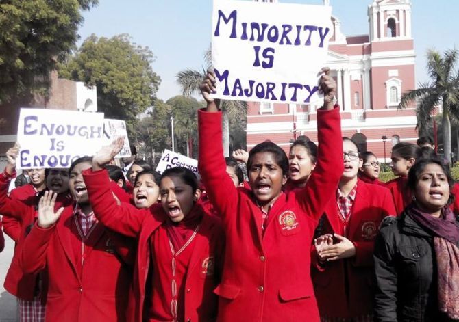 Protestors raise slogans outside the Sacred Heart Church in New Delhi. Photograph: Merril Diniz
