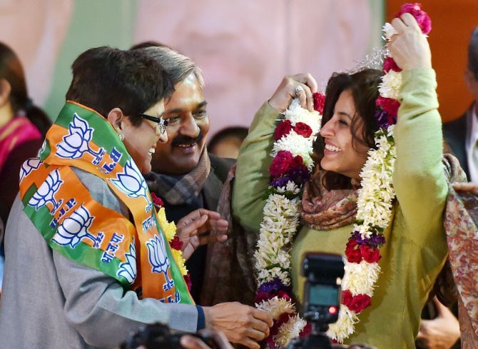 Kiran Bedi and Satish Upadhaya greet Shazia Ilmi as she joins the BJP.