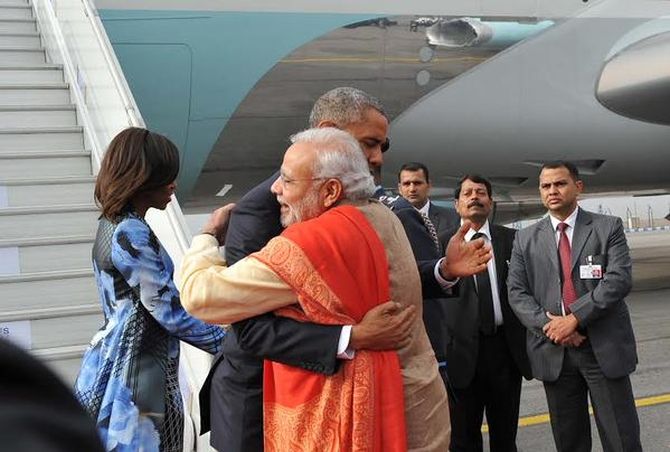 Prime Minister Narendra Modi hugs US President Barack Obama as Michelle Obama, in a Bibhu Mohapatra dress, greets other members of the welcoming party. 