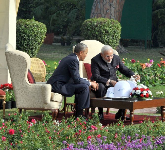 Prime Minister Narendra Modi plays the gracious host, as he prepares a cup of tea for US President Barack Obama at the Hyderabad House. Photograph: Press Information Bureau