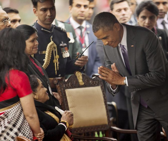 US President Barack Obama greets India's First Lady Suvra Mukherjee at the At Home reception hosted by President Pranab Mukherjee. Photograph: PTI photo