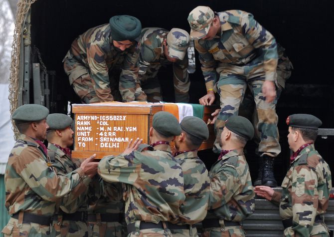Soldiers carry Colonel M N Rai's coffin. The colonel was killed in a gun battle with terrorists in Kashmir. Photograph: Reuters
