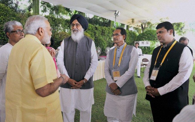 Prime Minister Narendra Modi with (from left to right) Tripura Chief Minister Manik Sarkar, then Punjab chief minister Parkash Singh Badal, Madhya Pradesh Chief Minister Shivraj Singh Chouhan and Maharashtra Chief Minister Devendra Fadnavis at the NITI Aayog Governing Council meeting, July 15, 2015. Photograph: PTI