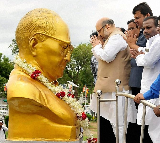 Amit Shah and other BJP leaders before a statue of Dr Ambedkar