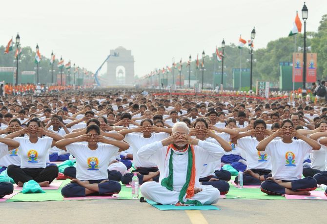 Narendra Modi performs yoga at Rajpath