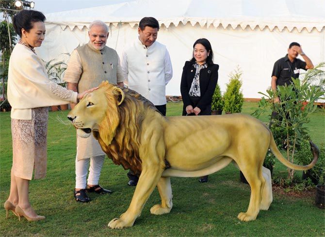China's First Lady Peng Liyuan, left, admires a statue of a Gir lion on the Sabarmati riverfront in Ahmedabad last September while her husband Chinese President Xi Jinping, third from left, and India's Prime Minister Narendra Modi look on. Photograph: Press Information Bureau