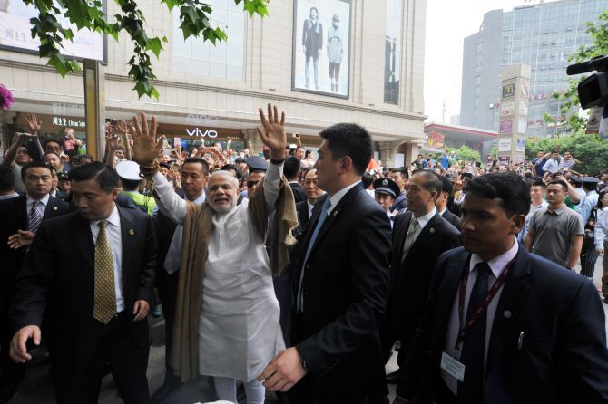 Prime Minister Narendra Modi greets people near the Daxingshan Temple in Xian, China on May 14