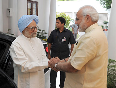 Prime Minister Narendra Modi greets Dr Manmohan Singh at 7, Racecourse Road, May 27. Photograph: Press Information Bureau