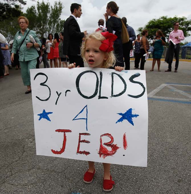 Three-year-old Claire Eorridt holds a sign supporting Jeb Bush outside a campaign kickoff rally where Bush formally announced his campaign for the 2016 Republican presidential nomination, in Miami, Florida, June 15. Photograph: Carlo Allegri/Reuters