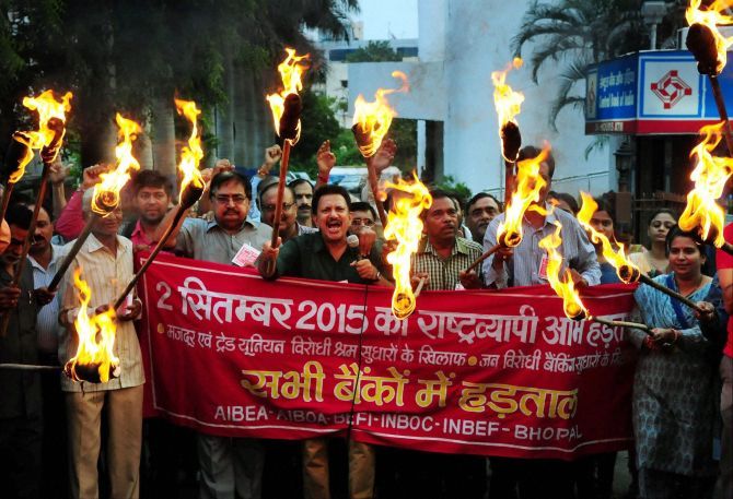 Bank workers stage a torch rally in Bhopal in support of the nation-wide strike September 2, 2015 to protest against the proposed labour reforms by the central and state governments. Photograph: PTI Photo