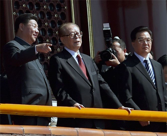  Chinese President Xi Jinping, left, talks with his predecessors Jiang Zemin and Hu Juntao at the  parade in Beijing, September 3. Photograph: Wang Zhao/Reuters