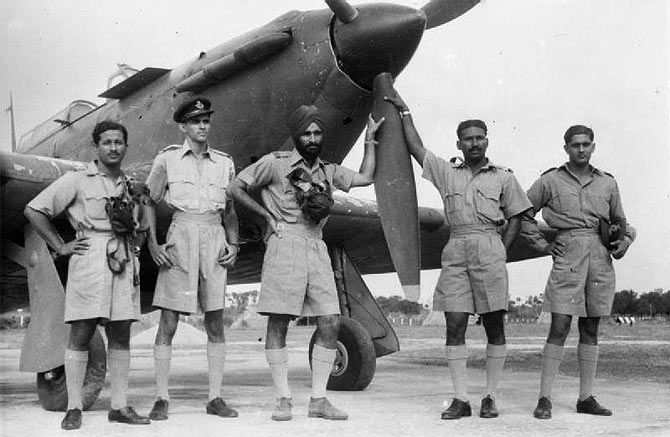 Marshal of the Air Force Arjan Singh as Flight Lieutenant with pilots of No 1 Squadron by a Hawker Hurricane aircraft in World War II in Burma. Photograph: Kind courtesy Imperial War Museum/Wikipedia.org