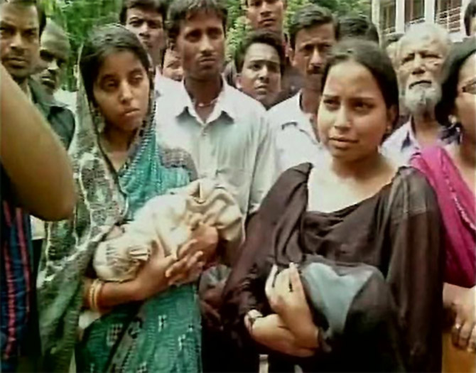 Distraught parents with their ailing children outside Sishu Bhawan.