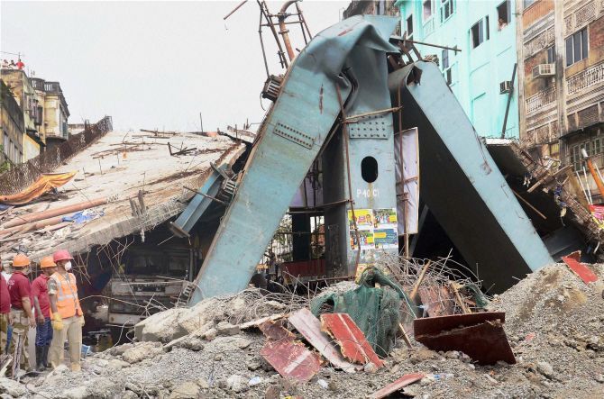 Rescue operations going on at the spot where an under-construction flyover collapsed on Vivekananda Road in Kolkata on Friday. Photograph: PTI Photo