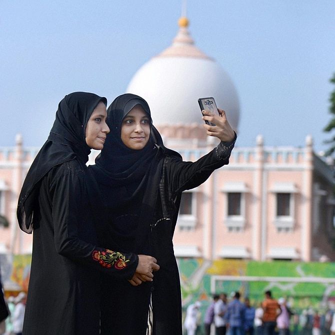 Girls take a selfie in Hyderabad.