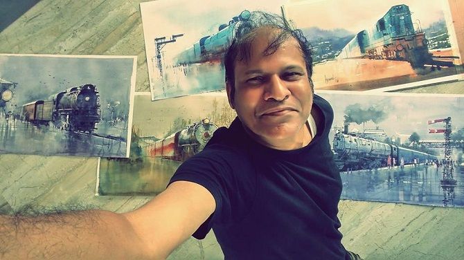 Bijay Biswaal with his paintings