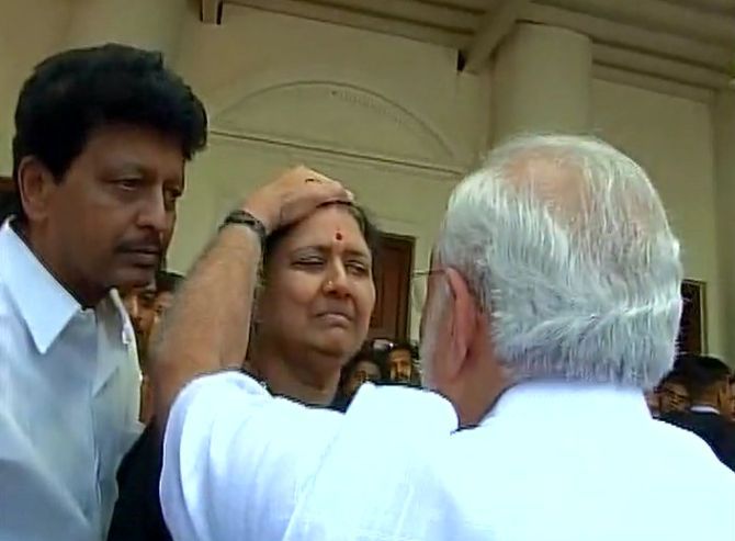 Prime Minister Narendra Modi consoles Sasikala at Rajaji Hall, Chennai, where Jayalalithaa's body was kept for public viewing on December 6, 2016. Looking on is Natarajan, Sasikala's husband who had been turned out by Jayalalithaa during her lifetime. Photograph: ANI