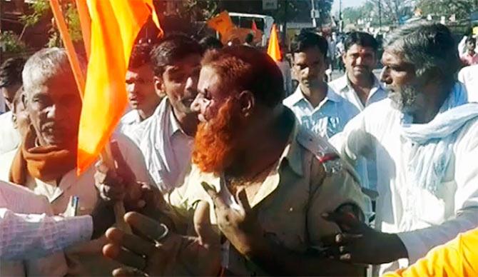 Video grab of a mob assaulting assistant sub inpsector Yunus Shaikh of Pangaon police station, Latur.