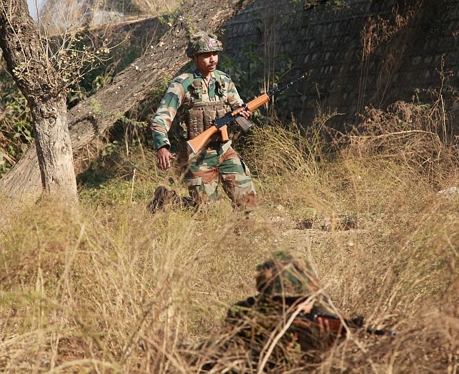 Soldiers conduct a search operation in a forest area outside the Indian Air Force base in Pathankot on Sunday, January 3. Photograph: PTI Photo