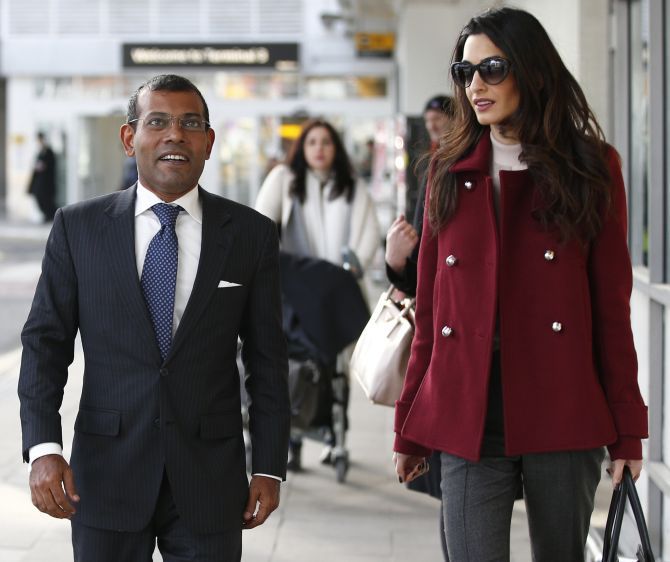 Deposed Maldivian president Mohamed Nasheed at Heathrow airport in London, January 21, 2016, with his lawyer Amal Clooney. Nasheed was granted medical leave from his 13-year jail sentence to have spinal surgery. Photograph: Peter Nicholls/Reuters