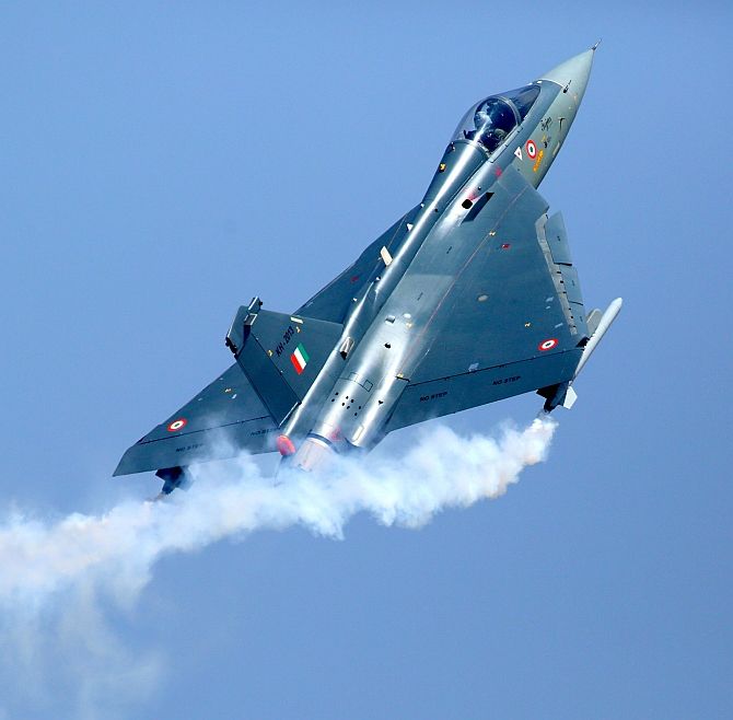 A Tejas aircraft, the fourth plus generation lightweight, multi-role supersonic single engine jet sporting the IAF colours, soars to the skies, July 1, 2016. Photograph: PTI