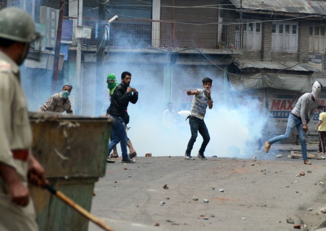 Demonstrators clash with the security forces in Kashmir. Photograph: Umar Ganie