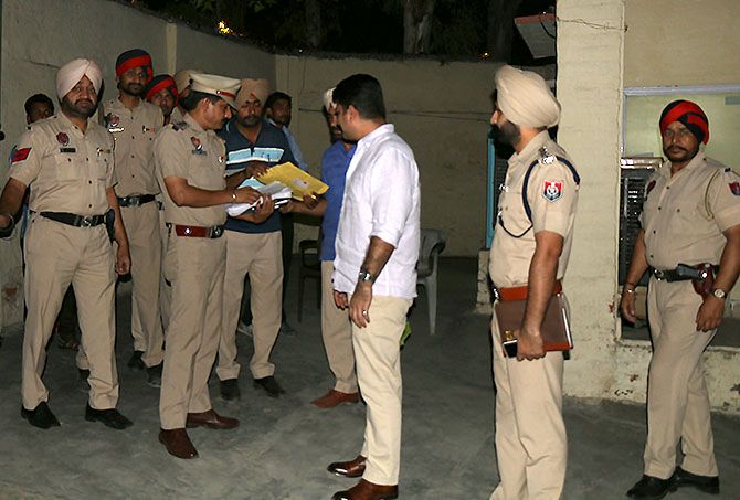 Swapan Sharma, the Senior Superintendent of Police, Bathinda with his officers