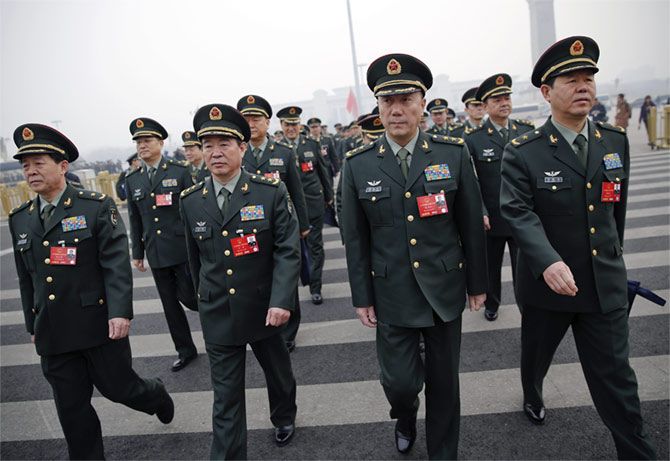People's Liberation Army officers in Beijing, March 4, 2016. Photograph: Damir Sagolj/Reuters
