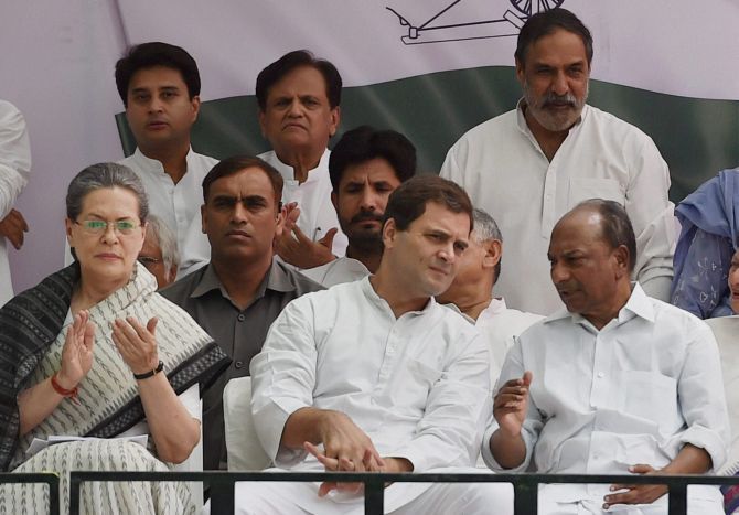 Sonia Gandhi and Rahul Gandhi at the Save Democracy rally at Jantar Mantar, New Delhi, May 6, 2016. Ahmed Patel can be seen, centre, standing. Photograph: Vijay Verma/PTI Photo