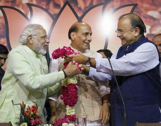 Prime Minister Narendra Modi, left, with Home Minister Rajnath Singh, centre, and Finance Minister Arun Jaitley.