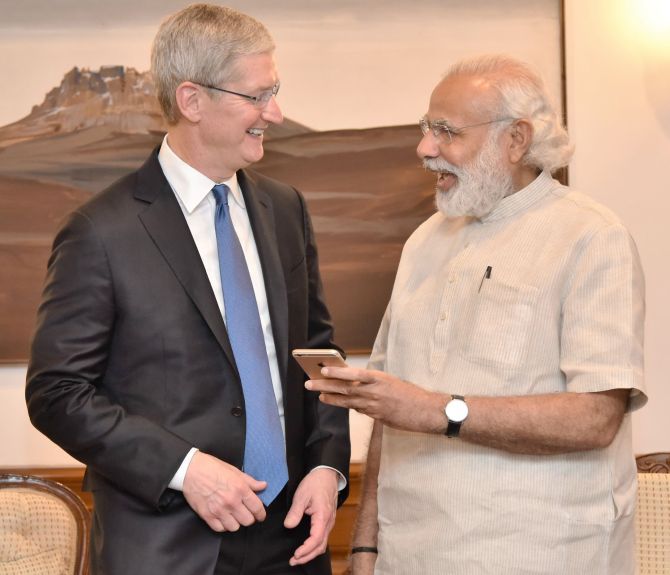 Apple CEO Tim Cook and PM Modi share a light moment during their meeting on Saturday. 