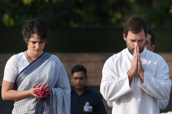 Rahul Gandhi and Priyanka Gandhi pay homage to their father, former prime minister Rajiv Gandhi, on his 25th death anniversary, at his memorial, May 21, 2016. Photograph: Manvender Vashist/PTI