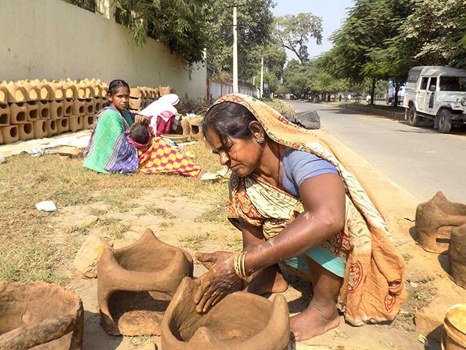 Muslim women making handmade earthen stoves for Chhath