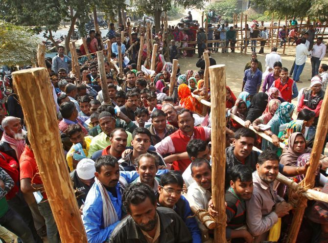  Villagers queue outside a bank on the outskirts of Allahabad. Photograph: Jitendra Prakash/Reuters