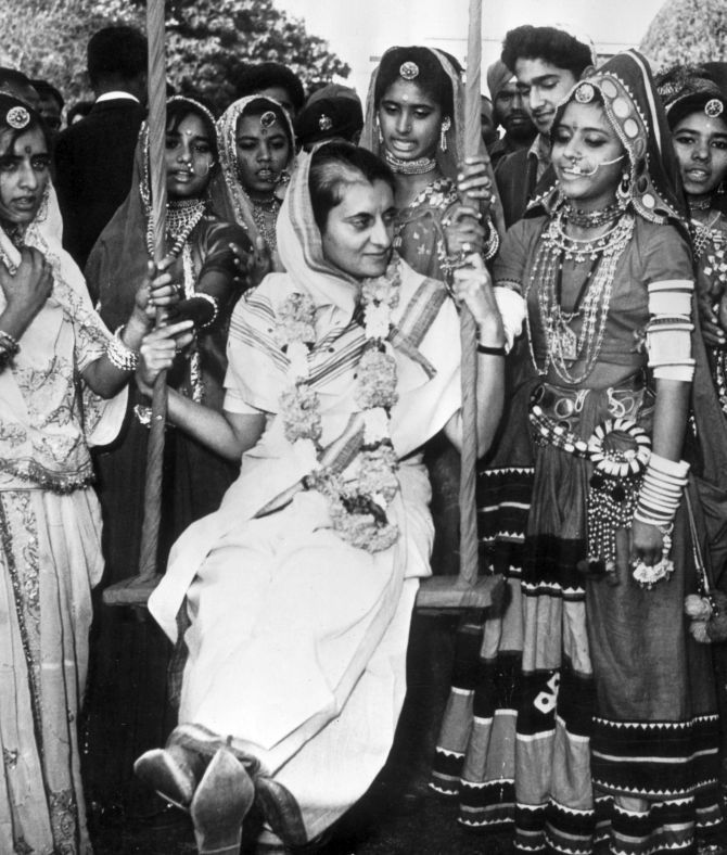 Indira Gandhi surrounded by folk dancers from Rajasthan at her home in New Delhi in 1967. Photograph: Express/Getty Images
