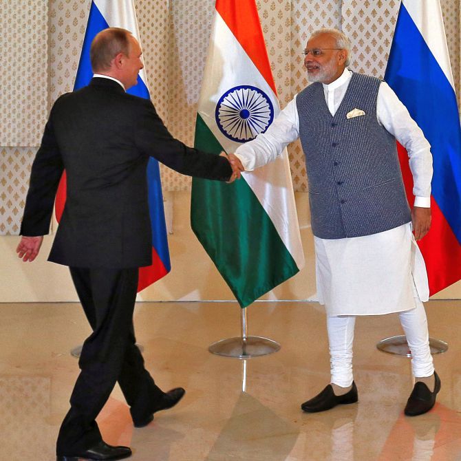 Prime Minister Narendra Modi greets Russian President Vladmir Putin at the BRICS summit in Goa, October 15, 2016.