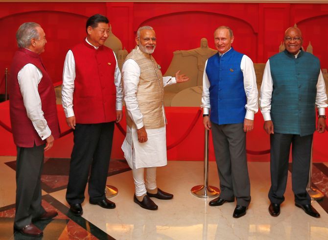 Brazil's President Michel Temer, Chinese President Xi Jinping, Prime Minister Narendra Modi, Russian President Vladimir Putin and South African President Jacob Zuma with Sudarsan Pattnaik's sand sculpture tribute to BRICS in Goa. Photograph: Danish Siddiqui/Reuters