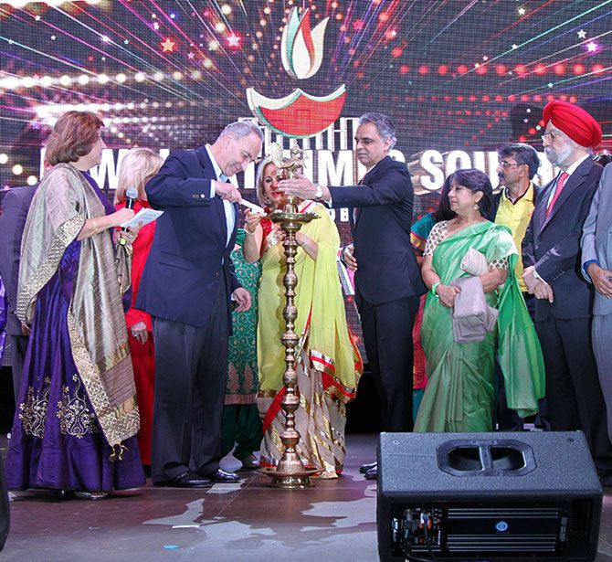 US Senator Chuck Schumer lights the lamp with some assistance from Ambassador Syed Akbaruddin, India's permanent representative to the United Nations, Diwali@Times Square, New York, October 16, 2016.
