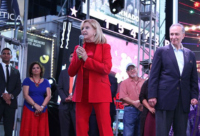 US Congresswoman Carolyn B Maloney, who co-helmed the successful Diwali Stamp project with Ranju Batra, addresses the crowds, as her fellow Democrat, US Senator Chuck Schumer looks on. Diwali@Times Square