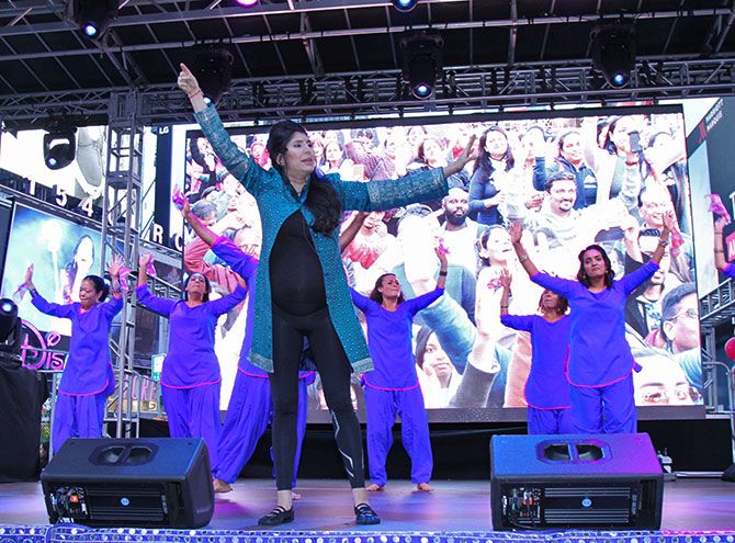 Masala Bhangra's Sarina Jain, who is 34 weeks pregnant, teaches the crowd at Diwali@Times Square some moves.