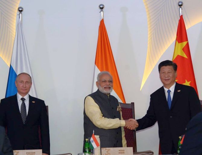 IMAGE: Prime Minister Narendra Modi with Chinese President Xi Jinping and Russian President Vladimir Putin at the BRICS summit in Goa. Photograph: BRICS/Facebook