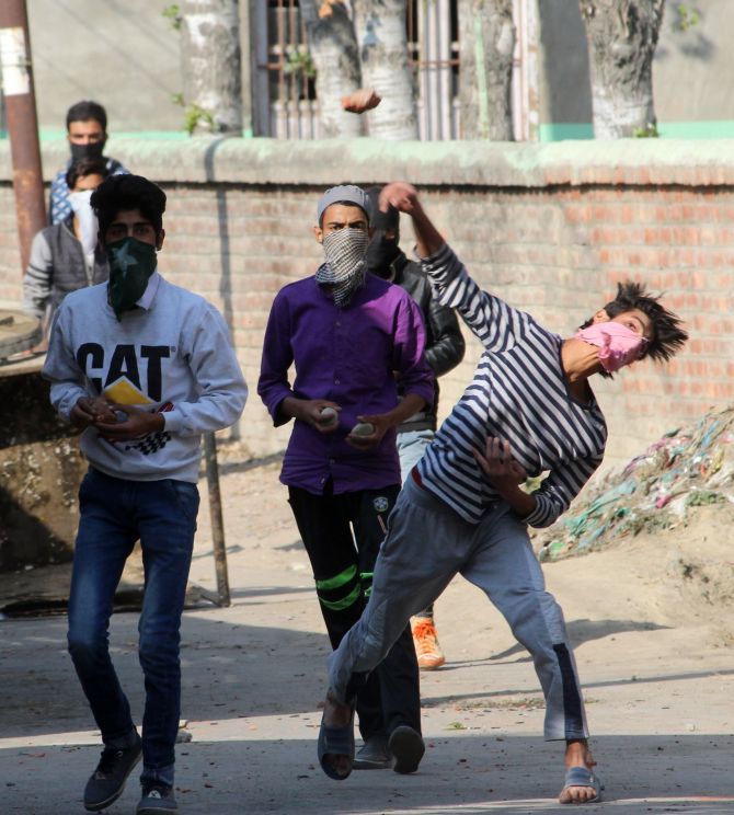 Kashmiri youth throw stones at the police, October 21, 2016. Photograph: Umar Ganie