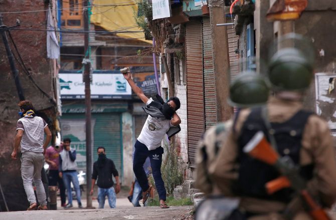 Kashmiri youth pelt stones at the security forces in Srinagar in September 2016.