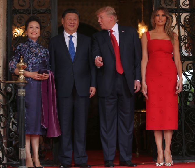 Chinese President Xi Jinping and his wife Peng Liyuan with US President Donald Trump and his wife Melania Trump at the start of their summit in West Palm Beach, Florida. Photograph: Carlos Barria/Reuters