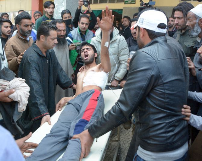 A youth injured in the April 9, 2017 violence shouts slogans as he is taken to hospital in Srinagar. Photograph: Umar Ganie for Rediff.com